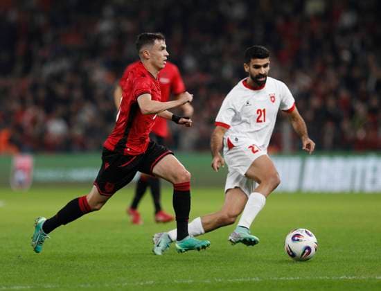Albania vs Jordan friendly match, Tirana, Albania on October 14, 2025. Albania s Jasir Asani (L) and Nizar Al-Rashdan (R) fight for the ball during a friendly football match between Albania and Jordan at the Air Albania Stadium in Tirana on October 14, 2025. TIRANE ALBANIA Copyright: xMALTONxDIBRAx