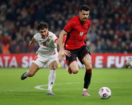 Albania vs Jordan friendly match, Tirana, Albania on October 14, 2025. Albania s Mirlind Daku (R) and Mohammad Abualnadi (L) fight for the ball during a friendly football match between Albania and Jordan at the Air Albania Stadium in Tirana on October 14, 2025. TIRANE ALBANIA Copyright: xMALTONxDIBRAx