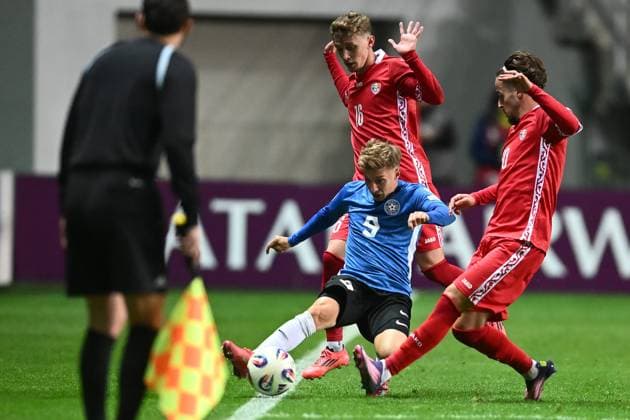 (251015) -- TALLINN, Oct. 15, 2025 -- Danila Forov (rear) and Stefan Bodisteanu (R) of Moldova vie against Ioan Yakovlev (Bottom) of Estonia during the FIFA World Cup, WM, Weltmeisterschaft, Fussball 2026 European Qualifiers Group I match between Moldova and Estonia in Tallinn, Estonia, Oct. 14, 2025. (Photo by Xinhua) (SP)ESTONIA-TALLINN-FOOTBALL-FIFA WORLD CUP-EUROPEAN QUALIFIERS-ESTONIA VS MOLDOVA SergeixStepanov 
