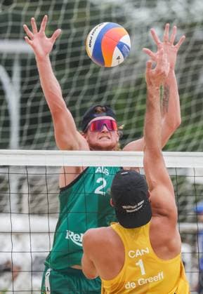 (251015) -- LAGUNA PROVINCE, Oct. 15, 2025 -- Oliver Merritt (back) of Australia competes against Luke de Greef of Canada during the men s qualification match between Ben Hood Oliver Merritt of Australia and Luke de Greef Martin Licht of Canada at the Volleyball World Beach Pro Tour in Laguna Province, the Philippines, Oct. 15, 2025. ) (SP)THE PHILIPPINES-LAGUNA PROVINCE-VOLLEYBALL WORLD BEACH PRO TOUR ROUELLExUMALI 