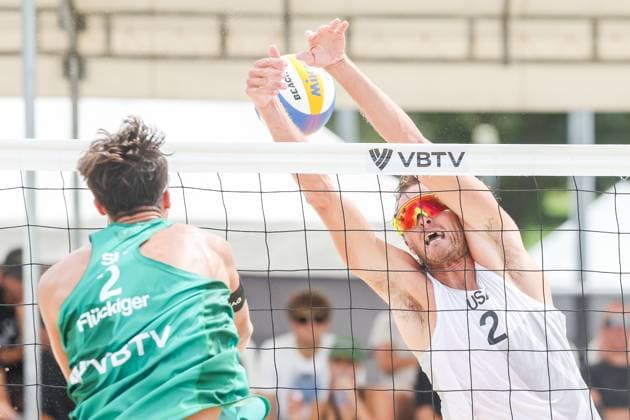 (251015) -- LAGUNA PROVINCE, Oct. 15, 2025 -- Logan Webber (R) of the United States competes against Luc Fluckiger of Switzerland during the men s qualification match between Hagen Smith Logan Webber of the United States and Florian Breer Luc Fluckiger of Switzerland at the Volleyball World Beach Pro Tour in Laguna Province, the Philippines, Oct. 15, 2025. ) (SP)THE PHILIPPINES-LAGUNA PROVINCE-VOLLEYBALL WORLD BEACH PRO TOUR ROUELLExUMALI 
