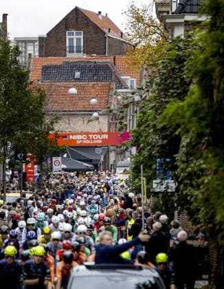 DORDRECHT - Cyclists cycle through the center of Dordrecht during the start of the first stage of the Tour of Holland. For the first time in 21 years, a cycling race will be held on Dutch soil. ANP KOEN VAN WEEL xVIxANPxSportx xxANPxIVx 539253142 originalFilename: 539253142.jpg