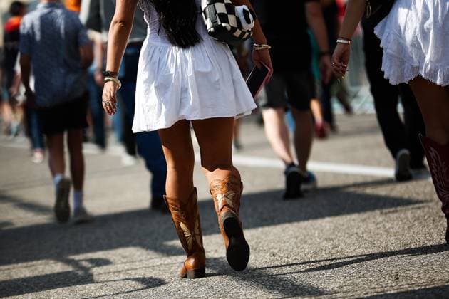 F1 - UNITED STATES GRAND PRIX 2025 Girl wearing the typical boots of Texas during the 2025 Formula 1 United States Grand Prix, 19th round of the 2025 FIA Formula One World Championship, WM, Weltmeisterschaft from October 17 to 19, 2025 on the Circuit of the Americas, in Austin, Texas, United States of America - AustinUnited States  Copyright: xEricxAlonsox