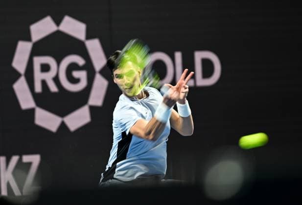 (251017) -- ALMATY, Oct. 17, 2025 -- Fabian Marozsan of Hungary hits a return during the men s singles quarterfinal match against Daniil Medvedev of Russia at the ATP250 Almaty Tennis Open in Almaty, Kazakhstan, on Oct. 17, 2025. ) (SP)KAZAKHSTAN-ALMATY-TENNIS-ALMATY OPEN-QUARTERFINAL LixRenzi 