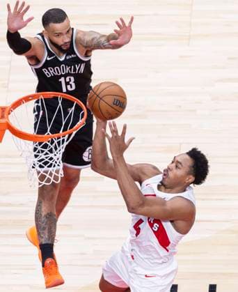 (251018) -- TORONTO, Oct. 18, 2025 -- Scottie Barnes (bottom) of Toronto Raptors goes up for a layup during the 2025-2026 NBA, Basketball Herren, USA preseason game between Toronto Raptors and Brooklyn Nets in Toronto, Canada, on Oct. 17, 2025. (Photo by Xinhua) (SP)CANADA-TORONTO-NBA-PRESEASON-NETS VS RAPTORS ZouxZheng 