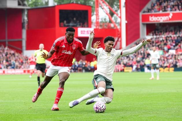 Nottingham, England, 18th October 2025. Josh Acheampong of Chelsea is challenged by Taiwo Awoniyi of Nottingham Forest during the Nottingham Forest vs Chelsea Premier League match at the City Ground, Nottingham. Picture credit should read: Jessica Hornby Sportimage EDITORIAL USE ONLY. No use with unauthorised audio, video, data, fixture lists, club league logos or live services. Online in-match use limited to 120 images, no video emulation. No use in betting, games or single club league player publications. SPI_024_JH_Forest_Chelsea SPI-4217-0024