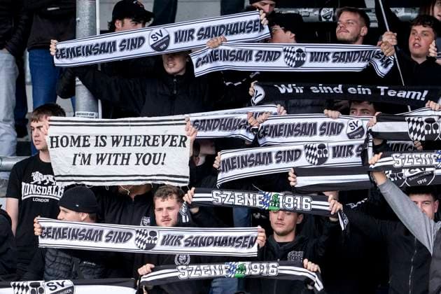 The Ultras of xxx wave their fan scarves in the fan curve, home fans, fan block, looking forward to the game, fans, audience, spectators, mood, atmosphere, stadium, 18 10 2025, Sandhausen Germany , Football, Regionalliga Südwest, SV Sandhausen 1 FSV Mainz 05 II xozx