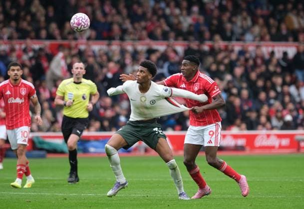 Taiwo Awoniyi of Nottingham Forest challenges for the ball against Josh Acheampong of Chelsea FC during the Premier league football match between Nottingham Forest and Chelsea FC at City Ground in Nottingham. Copyright: xPaulxBonser SportsxPressxPhotox Sportspressphoto_SPR43844