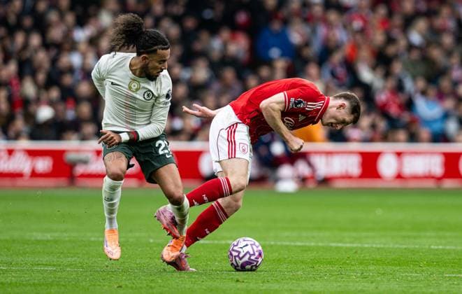 18th October 2025; The City Ground, Nottingham, England; Premier League Football, Nottingham Forest versus Chelsea; Elliot Anderson of Nottingham Forest is fouled by Malo Gusto of Chelsea  GodfreyxPitt