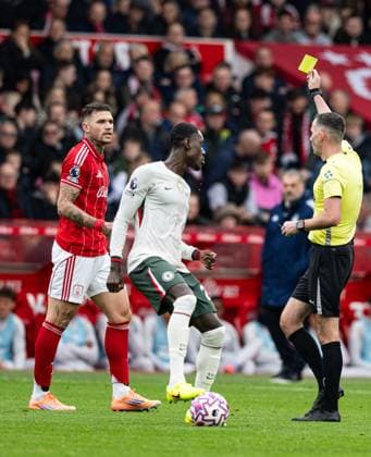 18th October 2025; The City Ground, Nottingham, England; Premier League Football, Nottingham Forest versus Chelsea; Referee Chris Kavanagh issues a yellow card to Morato of Nottingham Forest  GodfreyxPitt