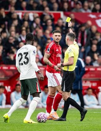 18th October 2025; The City Ground, Nottingham, England; Premier League Football, Nottingham Forest versus Chelsea; Referee Chris Kavanagh issues a yellow card to Morato of Nottingham Forest  GodfreyxPitt