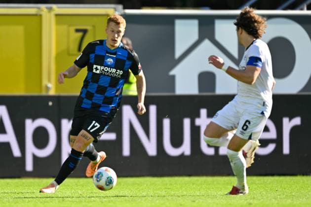 Paderborn, Home Deluxe Arena, 18 10 25, GER, Men, 2 Bundesliga, Season 2025 2026, SC Paderborn 07 DSC Arminia Bielefeld Picture from left in duel Laurin CURDA Paderborn and Mael CORBOZ Bielefeld DFL regulations prohibit any use of photographs as image sequences and or quasi video NRW Germany