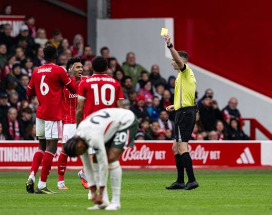 18th October 2025; The City Ground, Nottingham, England; Premier League Football, Nottingham Forest versus Chelsea; Referee Chris Kavanagh issues a yellow card to Ibrahim Sangare of Nottingham Forest  GodfreyxPitt