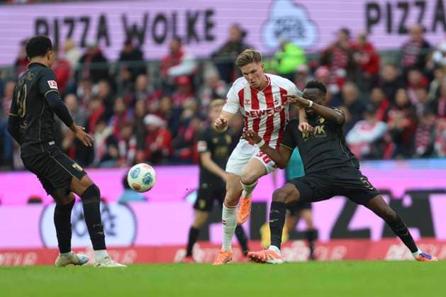 Marius Bülter (1. FC Koeln) und Iris Aurel Chrislain Matsima (FC Augsburg) im Zweikampf waehrend des spiels der Bundesliga zwischen 1. FC Köln und FC Augsburg, RheinEnergieSTADION am 18. October 2025 in Köln, Deutschland. (Foto von Oliver Kaelke DeFodi Images) +++ Marius Bülter (1. FC Koeln) und Iris Aurel Chrislain Matsima (FC Augsburg) battle for the ball during the Bundesliga match between 1. FC Köln and FC Augsburg at RheinEnergieSTADION on October 18, 2025 in Köln, Germany. (Photo by Oliver Kaelke DeFodi Images) DFL regulations prohibit any use of photographs as image sequences and or quasi-video. (Photo by Oliver Kaelke DeFodi Images) Marius Bülter 1 FC Koeln and Iris Aurel Chrislain Matsima FC Augsburg in a duel during the Bundesliga match between 1 FC Köln and FC Augsburg, RheinEnergieSTADION on October 18, 2025 in Köln, Germany Photo by Oliver Kaelke DeFodi Images Marius Bülter 1 FC Koeln and Iris Aurel Chrislain Matsima FC Augsburg battle for the ball during the Bundesliga match between 1 FC Köln and FC Augsburg at RheinEnergieSTADION on October 18, 2025 in Köln, Germany Photo by Oliver Kaelke DeFodi Images DFL regulations prohibit any use of photographs as image sequences and or quasi video Photo by Oliver Kaelke DeFodi Images