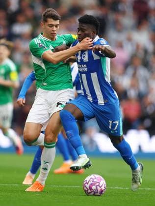 Brighton and Hove, England, 18th October 2025. Lewis Miley of Newcastle United and Carlos Baleba of Brighton and Hove Albion challenge for the ball during the Brighton and Hove Albion vs Newcastle United Premier League match at the AMEX Stadium, Brighton and Hove. Picture credit should read: Paul Terry Sportimage EDITORIAL USE ONLY. No use with unauthorised audio, video, data, fixture lists, club league logos or live services. Online in-match use limited to 120 images, no video emulation. No use in betting, games or single club league player publications. SPI_025_PT_Brighton_Newcastle SPI-4218-0025