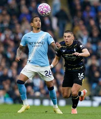Manchester, England, 18th October 2025. Savio of Manchester City (L) is challenged by of Everton during the Manchester City vs Everton Premier League match at the Etihad Stadium, Manchester. Picture credit should read: Andrew Yates Sportimage EDITORIAL USE ONLY. No use with unauthorised audio, video, data, fixture lists, club league logos or live services. Online in-match use limited to 120 images, no video emulation. No use in betting, games or single club league player publications. SPI_022_AY_MAN_CITY_EVERTON SPI-4220-0022