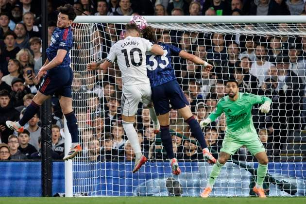 Football - 2025 2026 Premier League - Fulham vs Arsenal - Craven Cottage - Saturday 18th October 2025 Tom Cairney (Fulham FC) and Riccardo Calafiori (Arsenal FC) compete for the header in front of the Arsenal goal at Craven Cottage COLORSPORT DANIEL BEARHAM  csp_ful_ars_db_18102025_