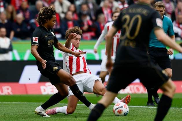 KOELN, GERMANY - OCTOBER 18: Ragnar Ache (1. FC Koeln, 9) tackles Han-Noah Massengo (FC Augsburg, 4) during the Bundesliga match between 1. FC Koeln vs. FC Augsburg at the Rheinenergie-Stadion on matchday 7 of the 1. Bundesliga on October 18, 2025 in Koeln, Germany. DFL REGULATIONS PROHIBIT ANY USE OF PHOTOGRAPHS AS IMAGE SEQUENCES AND OR QUASI-VIDEO. Nordrhein-Westfalen Germany Copyright: xBEAUTIFULxSPORTS AxelxKohringx