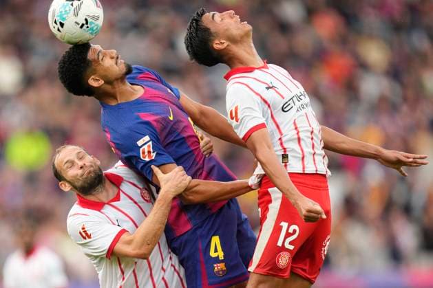 FC Barcelona, Barca v Girona FC - LaLiga EA Sports Ronald Araujo centre-back of Barcelona and Uruguay and Daley Blind and Vitor Reis centre-back of Girona compete for the ball during the La Liga EA Sports match between FC Barcelona and Girona FC at Estadi Olimpic Lluis Companys on October 18, 2025 in Barcelona, Spain. Barcelona Spain  Copyright: xJosexBretonx originalFilename:bretonhernandez-fcbarcel251018_npb7d.jpg