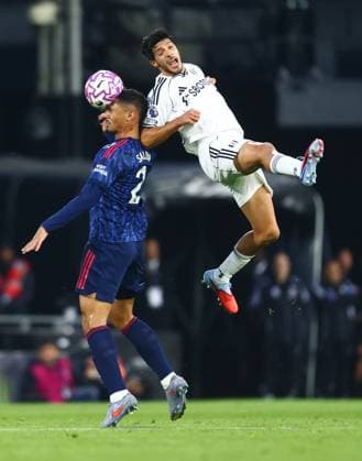 Fulham v Arsenal, English Premier League, Craven Cottage, London, UK - 18 10 2025 William Saliba of Arsenal wins ahead from Raul JimÃ nez of Fulhamin the Premier league game at Craven Cottage London Craven Cottage London GBR, UK NEWSPAPERS OUT Copyright: xMarkxGreenwoodx