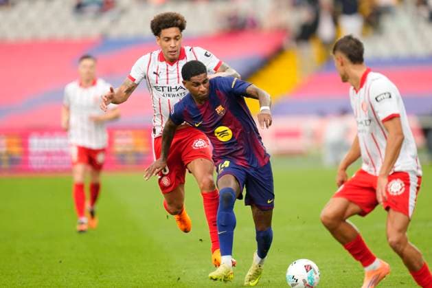 FC Barcelona, Barca v Girona FC - LaLiga EA Sports Marcus Rashford left winger of Barcelona and England and Axel Witsel defensive midfield of Girona and Belgium compete for the ball during the La Liga EA Sports match between FC Barcelona and Girona FC at Estadi Olimpic Lluis Companys on October 18, 2025 in Barcelona, Spain. Barcelona Spain  Copyright: xJosexBretonx originalFilename:bretonhernandez-fcbarcel251018_np8Qg.jpg