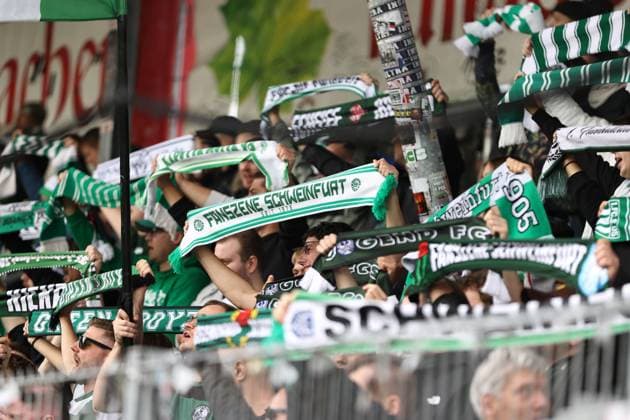 18 10 2025, Football, Men, 11 Matchday Third League Season 2025 2026 VfB Stuttgart II FC Schweinfurt 05 Schweinfurt fans hold their green and white scarves in the air