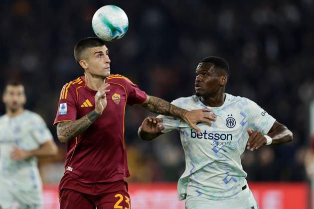 Serie a football match AS Roma vs Inter Roma™s Italian defender Gianluca Mancini challenges for the ball with Inter™s French forward Ange-Yoan Bonny during the Serie A football match between AS Roma vs Inter at the Olimpico Stadium in Rome, Italy on October 18, 2025. _BPH7806 Copyright: xAntonioxBalascox