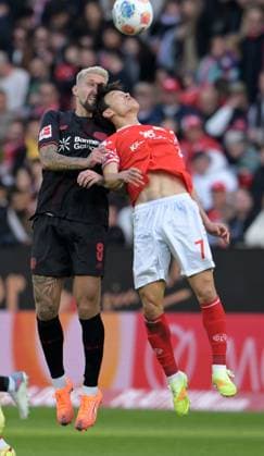 Jae Sung Lee re against Robert Andrich photographed at the soccer Bundesliga match Mainz 05 against Bayer 04 Leverkusen on 18 10 2025 in Mainz DFL DFB REGULATIONS PROHIBIT ANY USE OF PHOTOGRAPHS as IMAGE SEQUENCES and or QUASI VIDEO