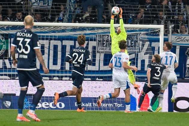 Timo Horn Bochum 1 thwarts scoring chance by Kennet Eichhorn BSC 23 and Sebastian Gronning BSC 17 18 10 2025 Football VfL Bochum vs Hertha BSC, Vonovia Ruhrstadion, Bochum, DFB DFL REGULATIONS PROHIBIT ANY USE OF PHOTOGRAPHS AS IMAGE SEQUENCES AND OR QUASI VIDEO Copyright: xpepphotox xSaschaxWeizx pep00321, pep_20251018_hm_167793