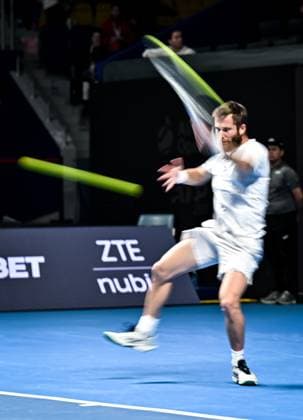 (251019) -- ALMATY, Oct. 19, 2025 -- Corentin Moutet of France hits a return during the men s singles semifinal match against Alex Michelsen of the United States at the ATP, Tennis Herren 250 Almaty Tennis Open in Almaty, Kazakhstan, on Oct. 18, 2025. ) (SP)KAZAKHSTAN-ALMATY-TENNIS-ALMATY OPEN-SEMIFINAL LixRenzi 