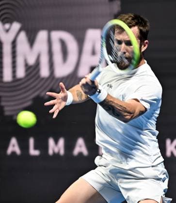 (251019) -- ALMATY, Oct. 19, 2025 -- Corentin Moutet of France hits a return during the men s singles semifinal match against Alex Michelsen of the United States at the ATP, Tennis Herren 250 Almaty Tennis Open in Almaty, Kazakhstan, on Oct. 18, 2025. ) (SP)KAZAKHSTAN-ALMATY-TENNIS-ALMATY OPEN-SEMIFINAL LixRenzi 