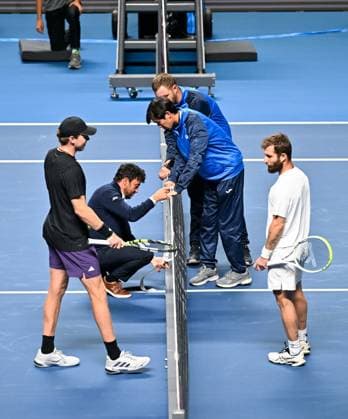(251019) -- ALMATY, Oct. 19, 2025 -- Referee checks the net during the men s singles semifinal match between Alex Michelsen (1st L) of the United States and Corentin Moutet of France at the ATP250 Almaty Tennis Open in Almaty, Kazakhstan, on Oct. 18, 2025. ) (SP)KAZAKHSTAN-ALMATY-TENNIS-ALMATY OPEN-SEMIFINAL LixRenzi 