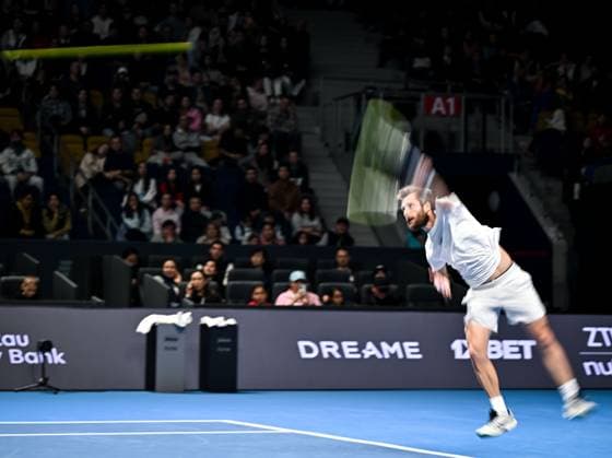 (251019) -- ALMATY, Oct. 19, 2025 -- Corentin Moutet of France serves during the men s singles semifinal match against Alex Michelsen of the United States at the ATP, Tennis Herren 250 Almaty Tennis Open in Almaty, Kazakhstan, on Oct. 18, 2025. ) (SP)KAZAKHSTAN-ALMATY-TENNIS-ALMATY OPEN-SEMIFINAL LixRenzi 