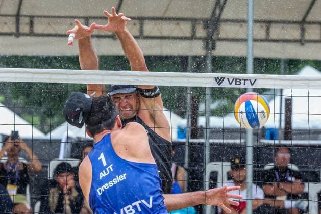 (251019) -- LAGUNA PROVINCE, Oct. 19, 2025 -- Alejandro Huerta Pastor (Back) of Spain competes against Christoph Dressler (Front) of Austria during the men s semifinal match between Alejandro Huerta Pastor Adrian Gavira Collado of Spain and Christoph Dressler Philipp Waller of Austria at the Volleyball World Beach Pro Tour in Laguna Province, the Philippines, Oct. 19, 2025. ) (SP)THE PHILIPPINES-LAGUNA PROVINCE-VOLLEYBALL WORLD BEACH PRO TOUR RouellexUmali 