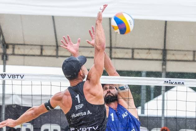 (251019) -- LAGUNA PROVINCE, Oct. 19, 2025 -- Alejandro Huerta Pastor (Front) of Spain competes against Christoph Dressler (Back) of Austria during the men s semifinal match between Alejandro Huerta Pastor Adrian Gavira Collado of Spain and Christoph Dressler Philipp Waller of Austria at the Volleyball World Beach Pro Tour in Laguna Province, the Philippines, Oct. 19, 2025. ) (SP)THE PHILIPPINES-LAGUNA PROVINCE-VOLLEYBALL WORLD BEACH PRO TOUR RouellexUmali 