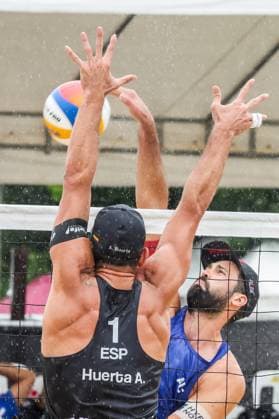 (251019) -- LAGUNA PROVINCE, Oct. 19, 2025 -- Alejandro Huerta Pastor (Front) of Spain competes against Christoph Dressler (Back) of Austria during the men s semifinal match between Alejandro Huerta Pastor Adrian Gavira Collado of Spain and Christoph Dressler Philipp Waller of Austria at the Volleyball World Beach Pro Tour in Laguna Province, the Philippines, Oct. 19, 2025. ) (SP)THE PHILIPPINES-LAGUNA PROVINCE-VOLLEYBALL WORLD BEACH PRO TOUR RouellexUmali 