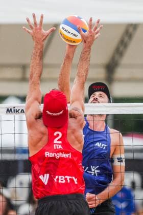 (251019) -- LAGUNA PROVINCE, Oct. 19, 2025 -- Alex Ranghieri (Front) of Italy competes against Christoph Dressler of Austria during the men s bronze medal match between Manuel Alfieri Alex Ranghieri of Italy and Christoph Dressler Philipp Waller of Austria at the Volleyball World Beach Pro Tour in Laguna Province, the Philippines, Oct. 19, 2025. ) (SP)PHILIPPINES-LAGUNA PROVINCE-VOLLEYBALL-WORLD BEACH PRO TOUR ROUELLExUMALI 