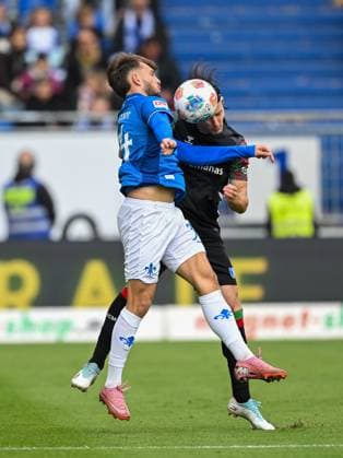 Killian Corredor SV Darmstadt 1898, 34 in duel with Jean Hugonet 1 FC Magdeburg, 24 , GER, SV Darmstadt 98 vs 1 FC Magdeburg Soccer, 2 Bundesliga, Matchday 9, Season 2025 2026, 19 10 2025 DFL REGULATES PROHIBIT ANY USE OF PHOTOGRAPHS AS IMAGE SEQUENCES AND OR QUASI VIDEO GER, SV Darmstadt 98 vs 1 FC Magdeburg Football, 2 Bundesliga, Matchday 9, Season 2025 2026, 19 10 2025 Darmstadt Copyright: xEibner-Pressefoto FlorianxWiegandx EP_FWD