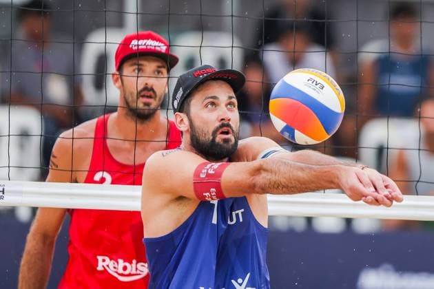 (251019) -- LAGUNA PROVINCE, Oct. 19, 2025 -- Christoph Dressler (Front) of Austria competes during the men s bronze medal match between Manuel Alfieri Alex Ranghieri of Italy and Christoph Dressler Philipp Waller of Austria at the Volleyball World Beach Pro Tour in Laguna Province, the Philippines, Oct. 19, 2025. ) (SP)PHILIPPINES-LAGUNA PROVINCE-VOLLEYBALL-WORLD BEACH PRO TOUR ROUELLExUMALI 