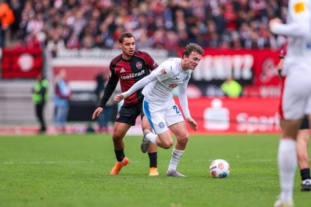 19 10 2025, 2 Bundesliga, Matchday 9, 1 FC Nürnberg Holstein Kiel, f l Tarek Buchmann 1 FC Nürnberg , Magnus Knudsen Holstein Kiel , Nürnberg Max Morlock Stadion Bayern Germany xRHR PHOTO DEx Copyright: DennisxEwert RHR-FOTOx RHR-FOTO DE
