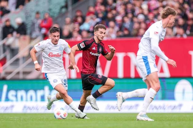 19 10 2025, 2 Bundesliga, Matchday 9, 1 FC Nürnberg Holstein Kiel, f l Adrian Kapralik Holstein Kiel , Adam Markhiev 1 FC Nürnberg , Nürnberg Max Morlock Stadion Bayern Germany xRHR PHOTO DEx Copyright: DennisxEwert RHR-FOTOx RHR-FOTO DE