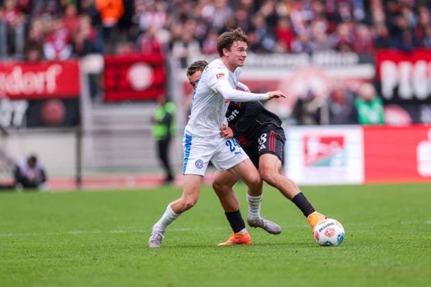19 10 2025, 2 Bundesliga, Matchday 9, 1 FC Nürnberg Holstein Kiel, f l Magnus Knudsen Holstein Kiel , Tarek Buchmann 1 FC Nürnberg , Nürnberg Max Morlock Stadion Bayern Germany xRHR PHOTO DEx Copyright: DennisxEwert RHR-FOTOx RHR-FOTO DE