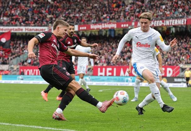 19 10 2025 Soccer Season 2025 2026 2 Soccer Bundesliga 09 Matchday 1 FC Nürnberg FCN Club KSV Holstein Kiel Storks Sportfoto Zink DaMa xdaxmax DFL regulations prohibit any use of photographs as image sequences and or quasi video only for editorial use Finn Ole Becker 25, 1 FC Nürnberg FCN Jonas Therkelsen 10, Holstein Kiel