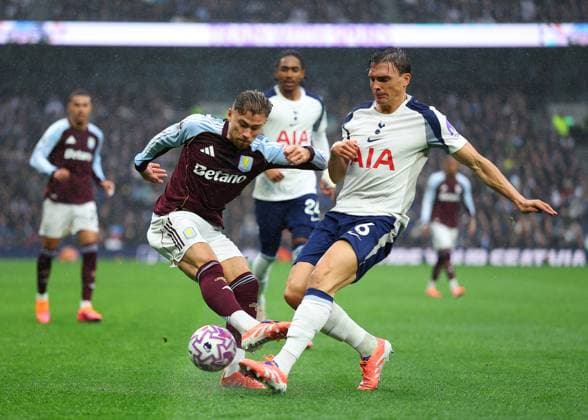 19th October 2025; Tottenham Hotspur Stadium, London, England; Premier League Football, Tottenham Hotspur versus Aston Villa; Joao Palhinha of Tottenham Hotspur challenged by Matty Cash of Aston Villa  JohnxPatrickxFletcher