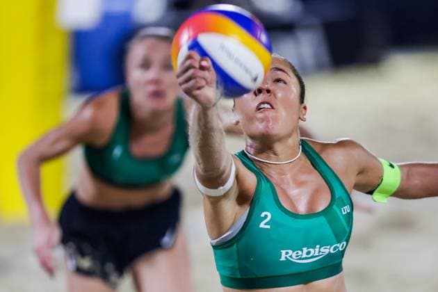 (251019) -- LAGUNA PROVINCE, Oct. 19, 2025 -- Gerda Grundzinskaite (Front) of Lithuania competes during the women s gold medal match between Anniina Parkkinen Valma Vilhelmiina Prihti of Finland and Ieva Dumbauskaite Gerda Grundzinskaite of Lithuania at the Volleyball World Beach Pro Tour in Laguna Province, the Philippines, Oct. 19, 2025. ) (SP)PHILIPPINES-LAGUNA PROVINCE-VOLLEYBALL-WORLD BEACH PRO TOUR ROUELLExUMALI 