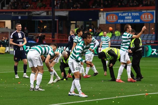 19th October 2025; Dens Park, Dundee, Scotland; Scottish Premiership Football, Dundee versus Celtic; Players clear the pitch after Celtic fans had disrupted the game by throwing balls on to get the game halted  DavidxYoung