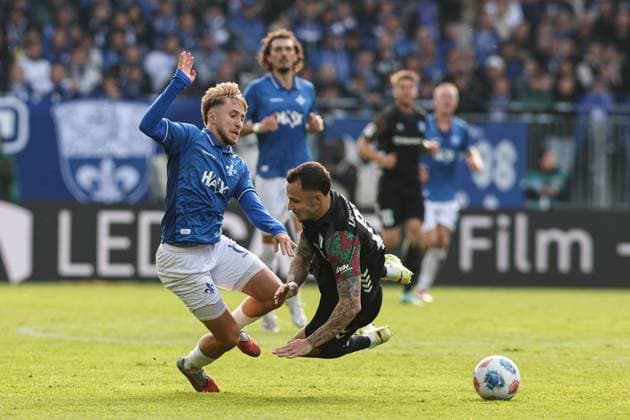 Lucas Marseiler SV Darmstadt 98,8 vs Falko Michel 1 FC Magdeburg,21 2 Soccer Bundesliga Season 2025 2026 SV Darmstadt 98 vs 1 FC Magdeburg at Merck Stadion am Böllenfalltor in Darmstadt Action,Soccer,Man,Men,Germany,19 10 2025