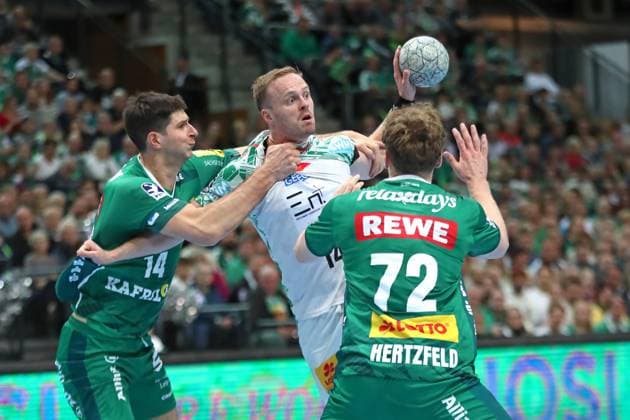 Handball DAIKIN HBL SC DHfK Leipzig SC Magdeburg 19 10 2025 Marko Mamic 14, SC DHfK Leipzig tackles Omar Ingi Magnusson 14, SC Magdeburg Handball, DAIKIN HBL, 1 Bundesliga, Season 2025 2026, Matchday 9 SC DHfK Leipzig vs SC Magdeburg on 19 10 2025 at Quarterback Immobilien Arena Leipzig Copyright: xBEAUTIFULxSPORTS JanxKaeferx