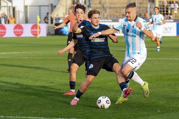 Foul by Patrick Sussek 37 MSV Duisburg on Sigurd Haugen 22 TSV 1860 Muenchen , TSV 1860 Muenchen vs MSV Duisburg, DFL, Dritte Liga, Saison 2025 2026, Stadion an der Gruenwalder Strasse, Hinrunde, 11 Spieltag, 19 10 2025 DFB regulations prohibit any use of photographs as image sequences and or quasi video Muenchen Bayern Germany Copyright: xkolbert-press MartinxAgüerax