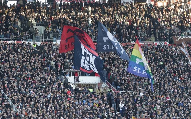 Pauli fan block with flags Football, 1 BL, Season 2025 2026, Men, FC St Pauli vs TSG 1899 Hoffenheim DFL REGULATIONS PROHIBIT ANY USE OF PHOTOGRAPHS AS IMAGE SEQUENCES AND OR QUASI VIDEO